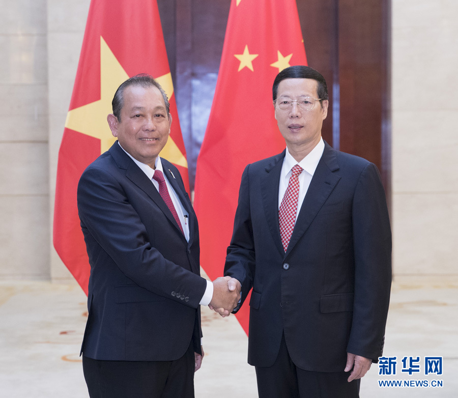  9月11日，中共中央政治局常委、國務院副總理張高麗在廣西南寧會見前來出席第十四屆中國－東盟博覽會和中國－東盟商務與投資峰會的越南常務副總理張和平。新華社記者王曄攝