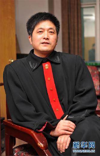 （圖文互動）其人如蘭，既潔且馨——追記“全國模范法官”胡國運