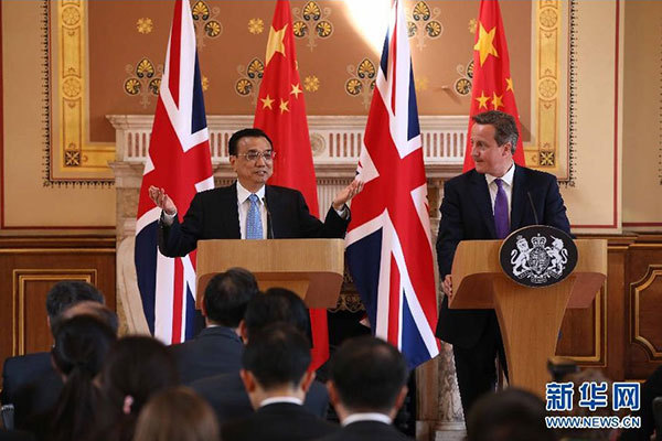     6月17日，國務院總理李克強同英國首相卡梅倫在倫敦舉行中英總理年度會晤后共同會見記者。 新華社記者 龐興雷 攝 